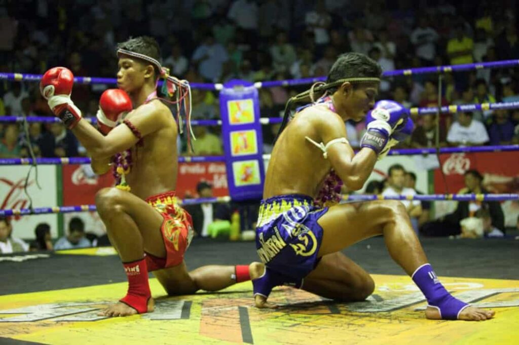 Muay Thai fighters performing Wai Kru ritual in Lumpinee Stadium